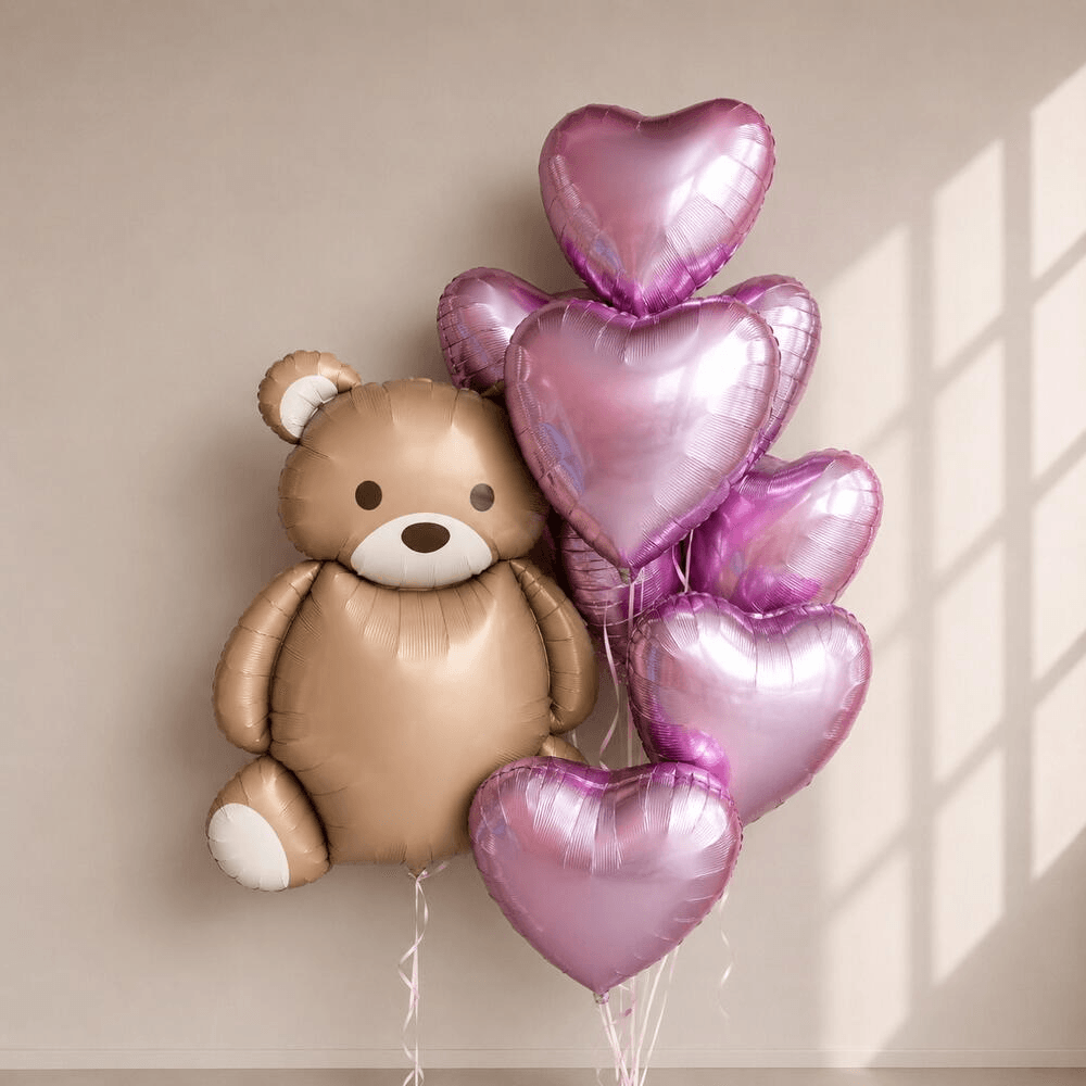 Fountain of 7 heart balloons with a teddy bear