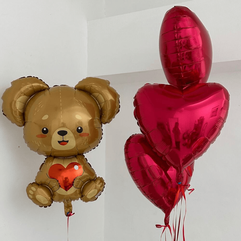 Heart balloons with a teddy bear